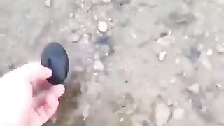 Carving a river stone into a Black Widow