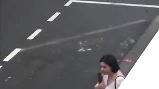 French police deal with a women wielding a shotgun