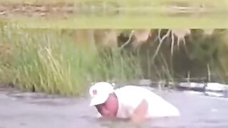 A Man Opens Up A Crocodile's Jaw With His Bare hands to Free