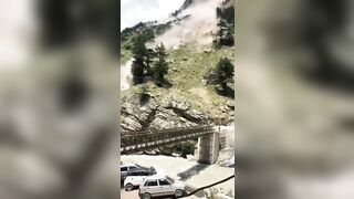 Rolling boulders from an adjacent hill destroys a bridge in