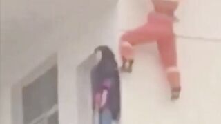 Fireman kicking suicidal people from the window