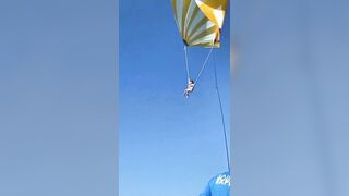 Parasailing girl falls and slams into water