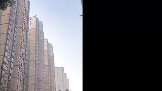 Chinese Psycho Jumps Off Tall Building