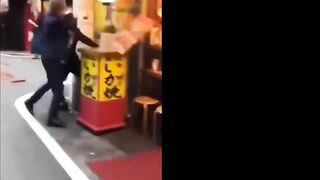 A Couple Of Japanese Dudes In Suits Go At It With One Of Them Getting The Short End Of Chair