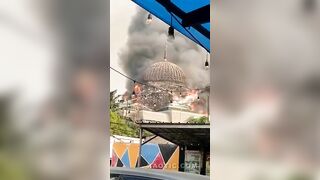 Huge mosque collapsing after fire in Jakarta.