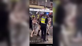 Crazy Bitch Kicks Cop in The Nuts