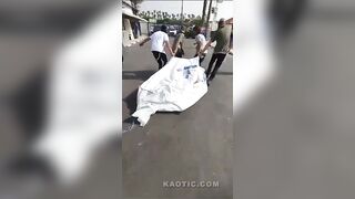 War Zone Footage: Dead Being Carried Out of The City