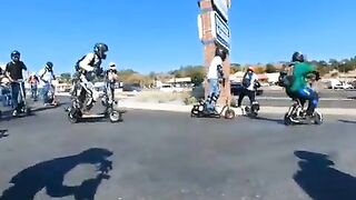 Electric Scooter Gang Has A Satisfying Chain Reaction