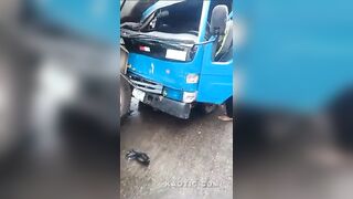 Nigerian Road Officer Sandwitched Between Two Vehicles