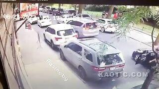 Moped rider gets hit with a cooler