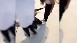 a girl being beaten by a group