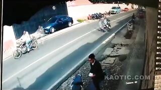 Biker Falls Head First Under The Truck