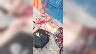 Guy gets stabbed in the throat, bleeds out in the street