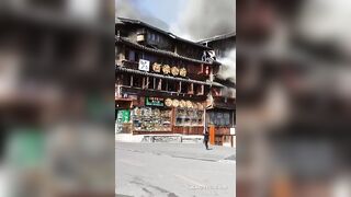 Tourists Jump Out Of The Burning Building In China