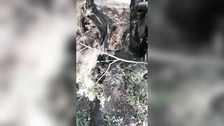 Russian Soldiers show off dead "mercenaries"