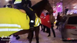 Mounted Police pushes Communist protesters away