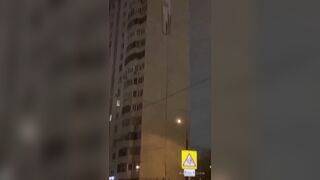 Russian huckster hanging a banner advertising drugs goes over the edge