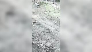 Russian soldiers examine and rejoice at the corpses of Ukrainian militants