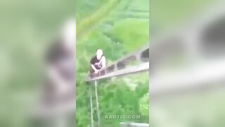 A drugged guy climbs the electric pole, touches live wire and falls down(repost)