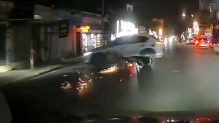 SUV attempts a 180° turn and takes out motorcyclist - Vietnam