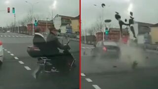 Two people are brutally sent airborne after car hits them off a scooter - China