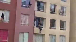 Man hospitalized after falling from a building while trying to prevent teenager committing suicide - Rimac, Peru