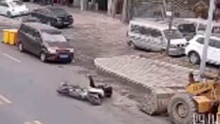 Man collides with excavator bucket after getting hit off his Motorcycle - China