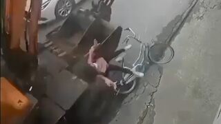 Cyclist was flattened by an excavator in Vietnam