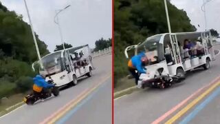 Motorcyclist collides with a minibus after speeding around corner in China