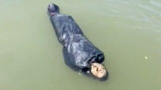 Teens find man wrapped in waste bags floating down river between border of Mexico and Guatemala