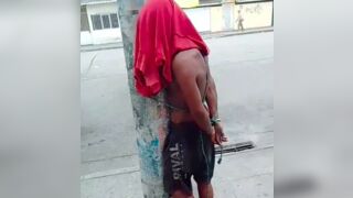 Thief starts crying after he was captured and tied to a post in Guayaquil, Ecuador