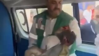 Palestinian medics transport mutilated dead child after IDF airstrikes