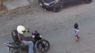 Child walks out into the street and is hit by a Motorcycle