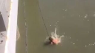 Thief is electrocuted to death after he jumped in a river and tried to grab a power line to save himself