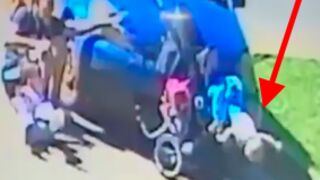 Oblivious driver runs over woman crossing the street with her stroller and ejects the baby underneath the vehicle
