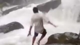 Man is killed after slipping off a rock into a waterfall in India