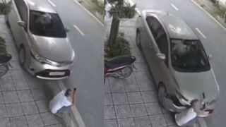 Man is run over while sitting on the curb using his phone in Vietnam