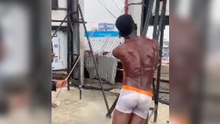 Thief was caught then tied to a post and beaten with a bamboo stick by construction workers in Nigeria