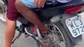 Motorcycle passenger got his foot caught in the rear wheels spokes while it was rotating