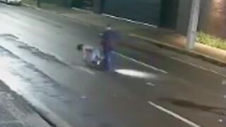 Man knocks woman out in the middle of the road before she is brutally run over by passer-by (+ Aftermath)