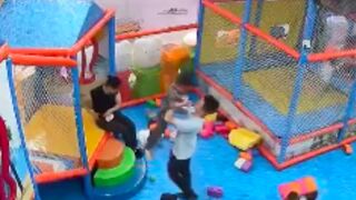 Man chilling inside a children's playpen assaults a child for getting in his way, China