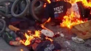 Mob in Haiti capital burns to death 13 suspected gang members