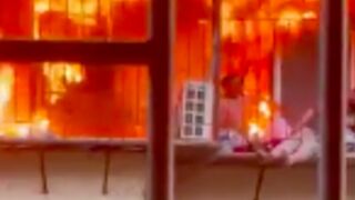 Couple trapped by iron gate and burn alive after their apartment caught fire, China