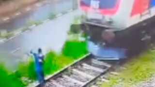 Headphone wearing student is wiped out by Train in Sri Lanka