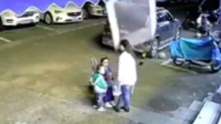 Woman and her two kids are knocked to the ground by a falling window, China