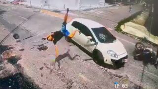 Man fleeing from police, crashes at junction and cartwheels into the front of a store, Brazil