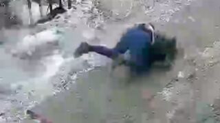 Woman is struck on the head and knocked down by a block of Ice in China