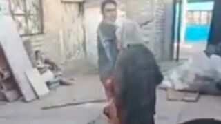 Old lady is knocked out by a young man with a metal tube in India