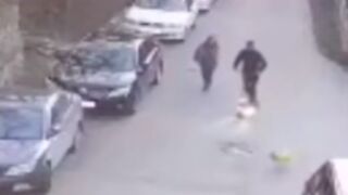 Man on electric scooter rides into dog leash sending it flying into the side of a car