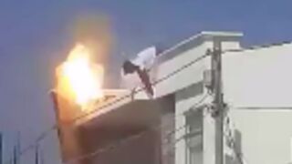 Worker is cooked on top of roof by high voltage cable